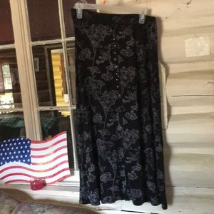 Briggs black long skirt with with flower print.